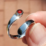 Hand of woman holding the Carnelian and Sterling Silver Adjustable Ring with One Stone