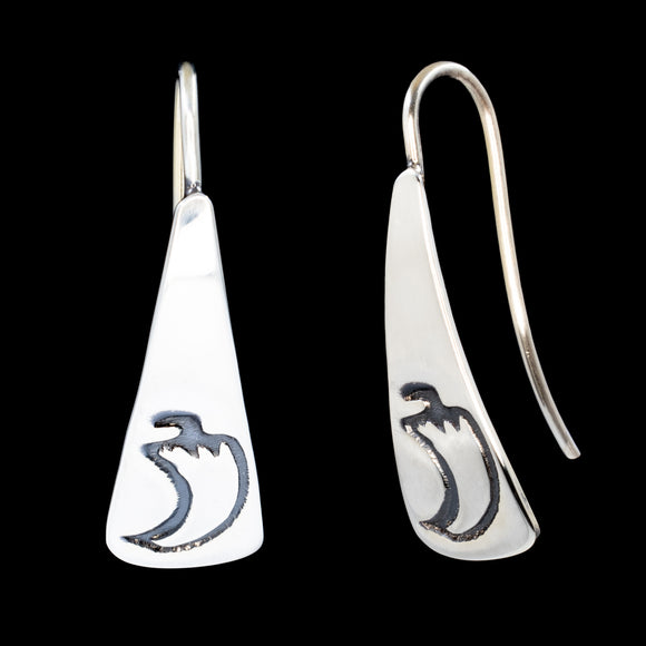 Front and side views of triangle-shaped sterling silver dangle earrings stamped with chile peppers from Capulin Creations