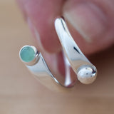 Hand of Woman Holding Chrysoprase and Sterling Silver Adjustable Ring with One Stone and One Granule