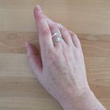 Hand of Woman Wearing Chrysoprase and Sterling Silver Adjustable Ring with One Stone and One Granule