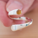 Hand of woman holding the Citrine and Sterling Silver Adjustable Ring with One Stone
