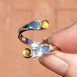 Hand of woman holding the Citrine and Sterling Silver Adjustable Ring with Two Stones