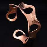 Side view of hammered copper cuff bracelet with ovals from Capulin Creations