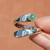 Hand Holding the Emerald and Sterling Silver Adjustable Ring with One Stone