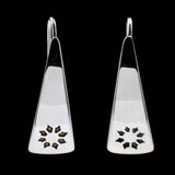 Front view of triangle-shaped sterling silver earrings stamped with flowers from Capulin Creations