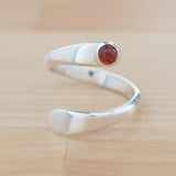Front view of the Garnet and Sterling Silver Adjustable Ring with One Stone