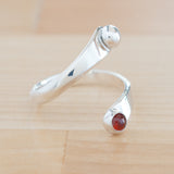 Side view of the Garnet and Sterling Silver Adjustable Ring with One Stone and One Granule