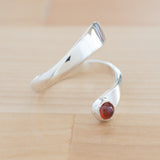 Side view of the Garnet and Sterling Silver Adjustable Ring with One Stone