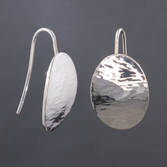 Front and side views of hammered dangle earrings in sterling silver