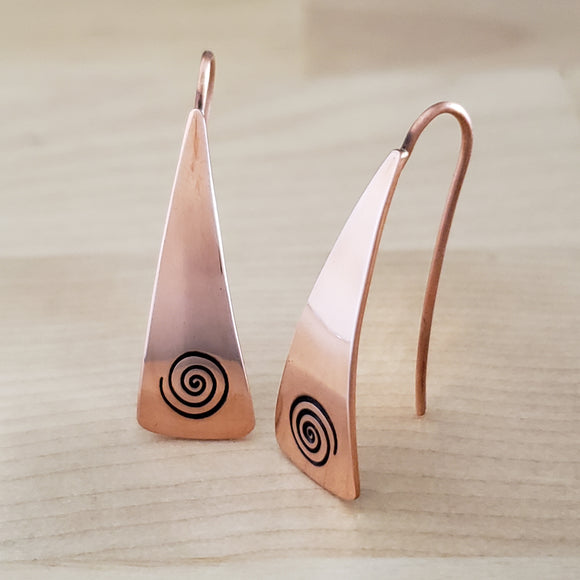 Front Views of Triangle-Shaped Dangle Earrings in Copper Stamped with Large Spirals
