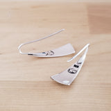 Back Views of Triangle-Shaped Dangle Earrings in Sterling Silver Stamped with Large Spirals