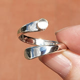 Hand of Woman Holding the Moonstone and Sterling Silver Adjustable Ring with One Stone