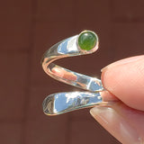 Hand of woman holding the Nephrite Jade and Sterling Silver Adjustable Ring with One Stone