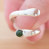Hand of woman holding the Nephrite Jade and Sterling Silver Adjustable Ring with One Stone