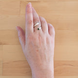 Hand of woman wearing the Nephrite Jade and Sterling Silver Adjustable Ring with One Stone