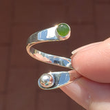 Hand of woman holding the Nephrite Jade and Sterling Silver Adjustable Ring with One Stone and One Granule