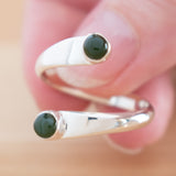 Hand of woman holding the Nephrite Jade and Sterling Silver Adjustable Ring with Two Stones