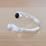 Side view of the Onyx and Sterling Silver Adjustable Ring with One Stone and One Granule