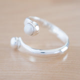 Side View of Pearl and Sterling Silver Adjustable Ring with One Stone and One Granule