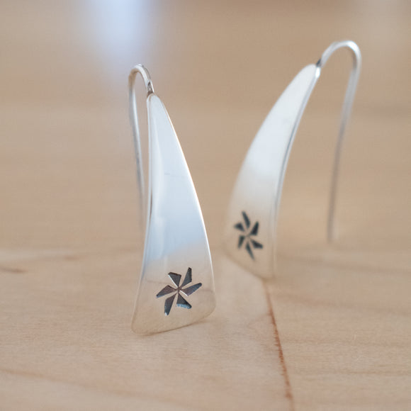 Front View of Triangle-Shaped Dangle Earrings in Sterling Silver Stamped with Pinwheels