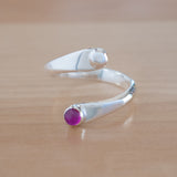Front view of the Ruby and Sterling Silver Adjustable Ring with One Stone and One Granule