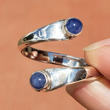 Hand of woman holding the Sapphire and Sterling Silver Adjustable Ring with Two Stones