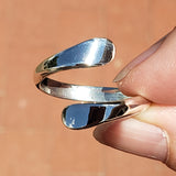Hand of woman holding the Sterling Silver Adjustable Ring