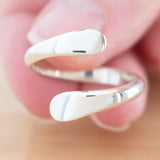 Hand of woman holding the Sterling Silver Adjustable Ring
