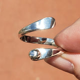 Hand of woman holding the Sterling Silver Adjustable Ring with One Granule