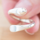 Hand of woman holding the Sterling Silver Adjustable Ring with One Granule