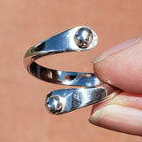 Hand of woman holding the Sterling Silver Adjustable Ring with Two Granules