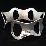 Side view of hammered silver cuff bracelet with ovals from Capulin Creations