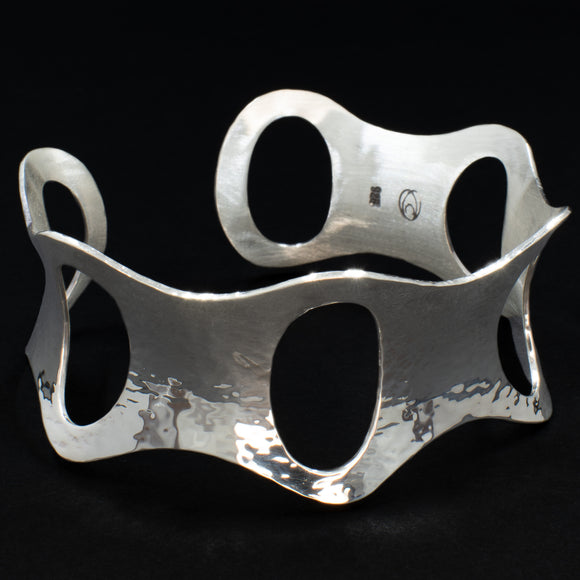 Front view of hammered silver cuff bracelet with ovals from Capulin Creations