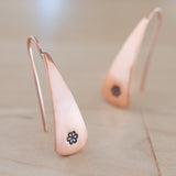 Front Views of Triangle-Shaped Dangle Earrings in Copper Stamped with Small Flowers