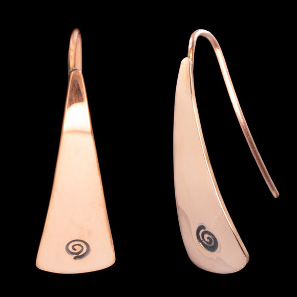 Front and side views of triangle-shaped copper earrings stamped with small spirals from Capulin Creations