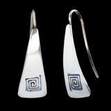 Front and side views of triangle-shaped sterling silver earrings stamped with square spirals from Capulin Creations