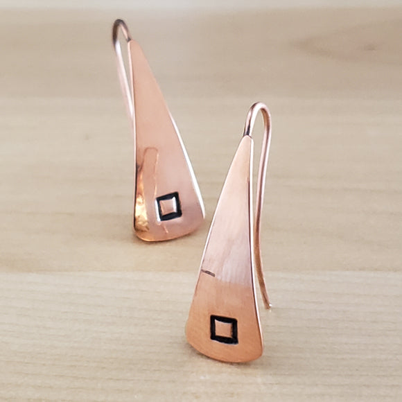 Front views of Triangle-Shaped Dangle Earrings in Copper stamped with squares