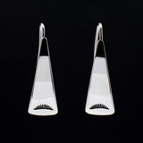 Front view of triangle-shaped sterling silver earrings stamped with sunrays from Capulin Creations