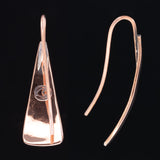 Back and side views of triangle-shaped copper dangle earrings stamped with chile peppers from Capulin Creations