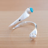 Side view of the Turquoise and Sterling Silver Adjustable Ring with One Stone and One Granule