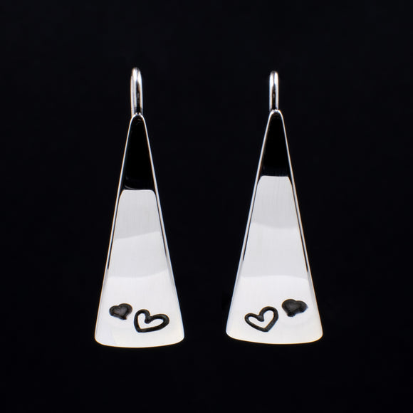Front View of Triangle-Shaped Dangle Earrings in Sterling Silver Stamped with Two Hearts
