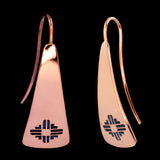 Front and side views of triangle-shaped copper earrings stamped with Zia sun symbols from Capulin Creations